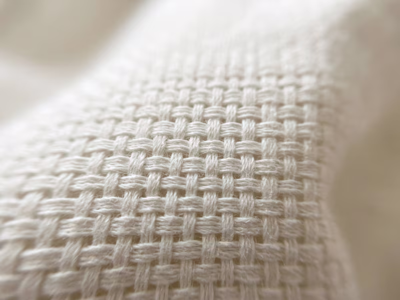 Close up of woven cotton sheet fabric Close up of woven cotton sheet fabric